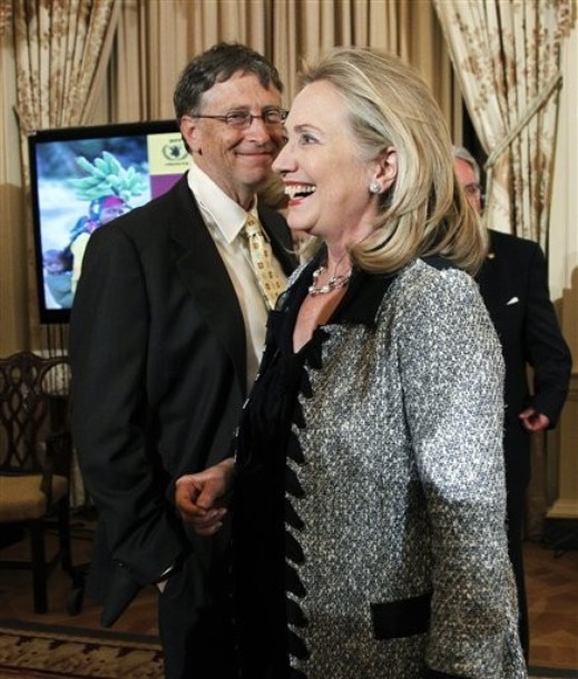 World Food Program's 2011 George McGovern Leadership Award recipient Bill Gates, left, looks at Secretary of State Hillary Rodham Clinton, right, as she walks towards invited guests at the conclusion of a ceremony honoring Gates and Howard Buffet at the State Department in Washington, Monday, Oct. 24, 2011.  (AP Photo/Manuel Balce Ceneta)